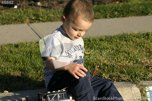 Image of Little Boy Looking Down at the Antenna