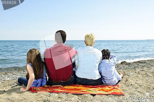 Image of Family sitting at beach