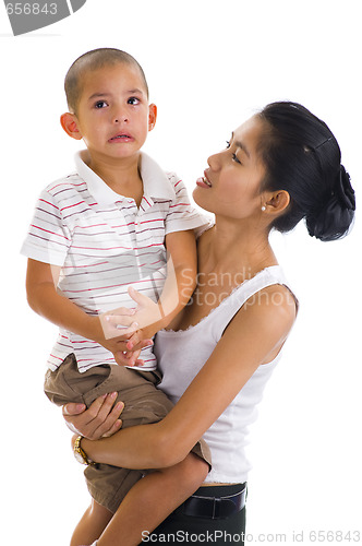 Image of woman holding a cute crying boy