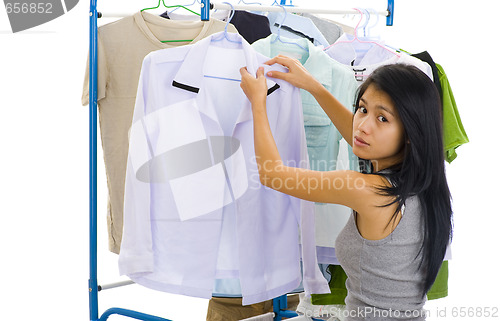 Image of woman hanging clothes