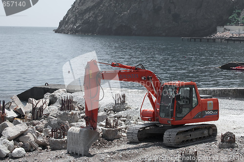 Image of excavator digging