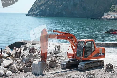 Image of excavator digging