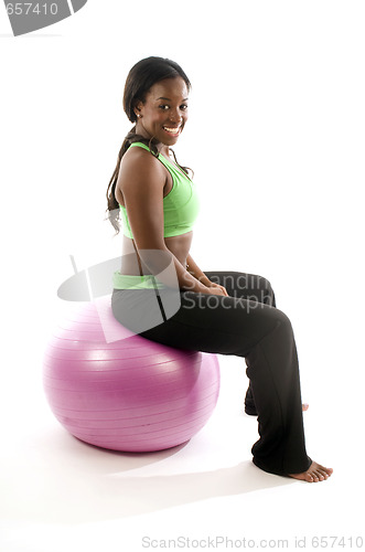 Image of young pretty hispanic african american woman exercising with fit