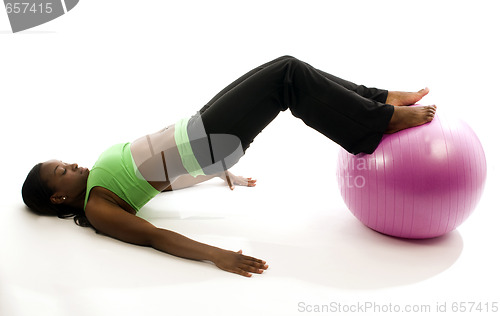 Image of young pretty hispanic african american woman exercising with fit