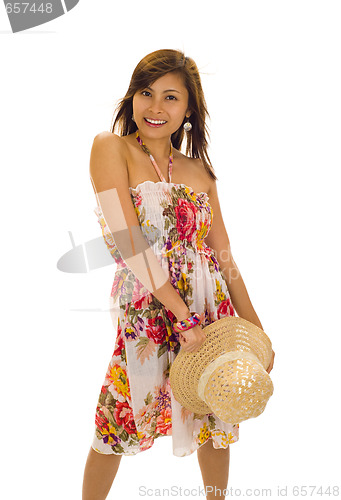 Image of woman with straw hat in her hand