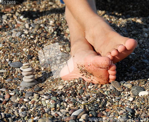 Image of Rocks stack and boy feet