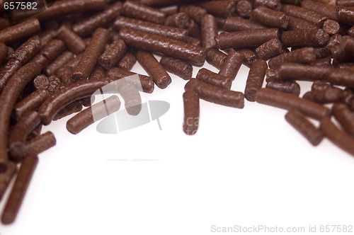 Image of 
chocolate sprinkles on white background. frame