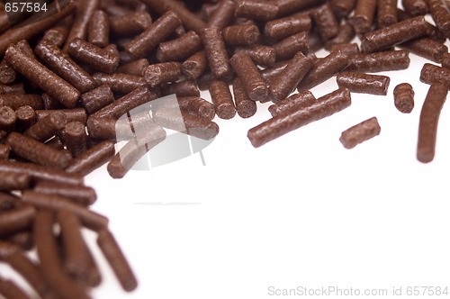 Image of 
chocolate sprinkles on white background. frame