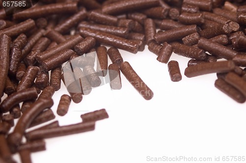 Image of 
chocolate sprinkles on white background. frame