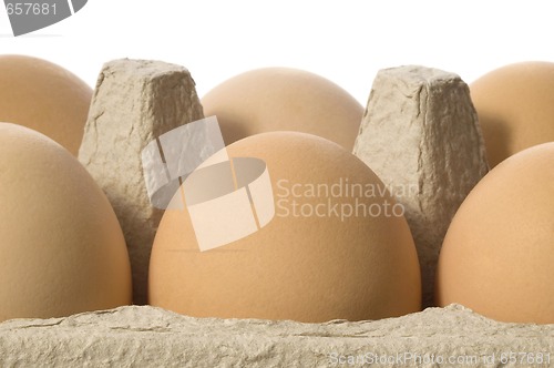 Image of eggs in a grey cardboard carton box