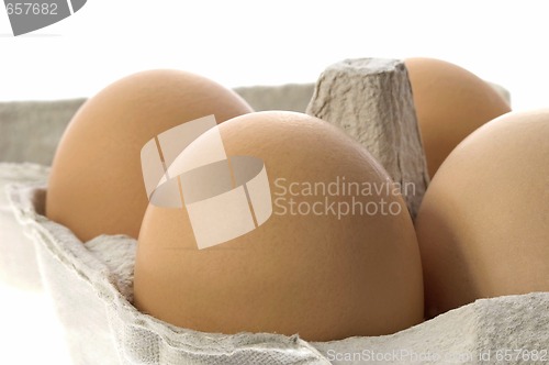 Image of eggs in a grey cardboard carton box