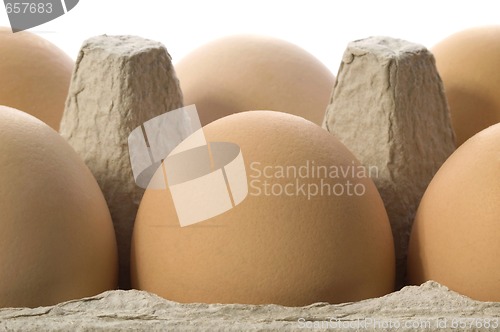 Image of eggs in a grey cardboard carton box