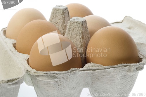 Image of eggs in a grey cardboard carton box