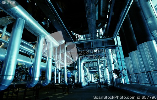 Image of different size and shaped pipes at a power plant