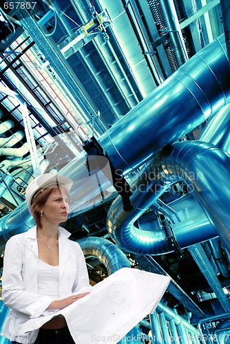 Image of woman engineer pipes, tubes, machinery and steam turbine at a po