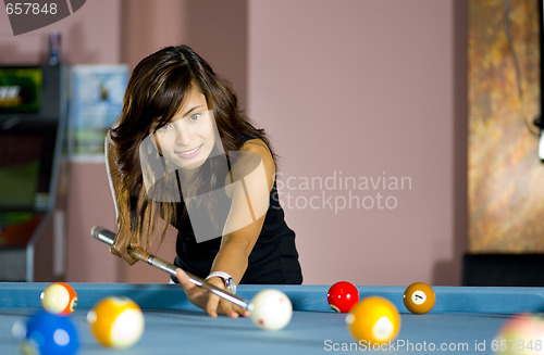 Image of woman playing pool