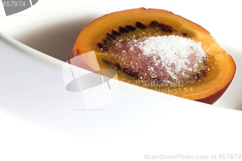 Image of tropical fruit tamarillo with sugar, isolated on white