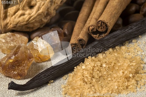 Image of vanilla, cinnamon sticks and other spices and ingredients. Chris