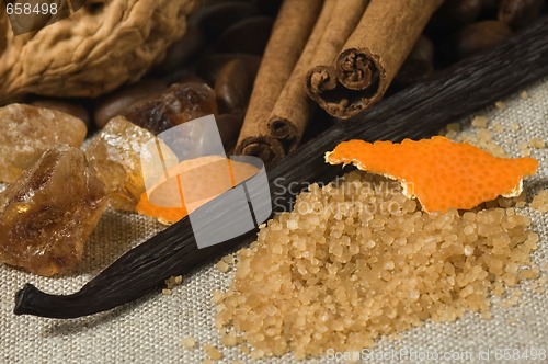 Image of vanilla, cinnamon sticks and other spices and ingredients. Chris