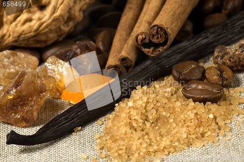 Image of vanilla, cinnamon sticks and other spices and ingredients. Chris