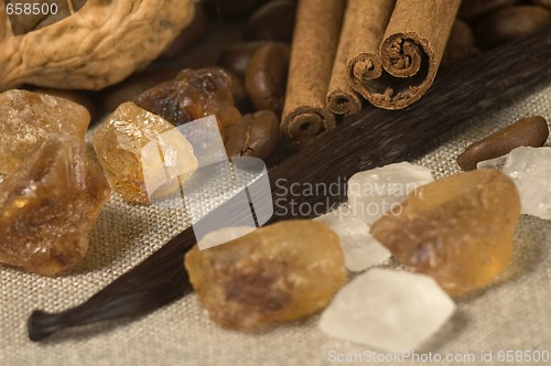 Image of vanilla, cinnamon sticks and other spices and ingredients. Chris