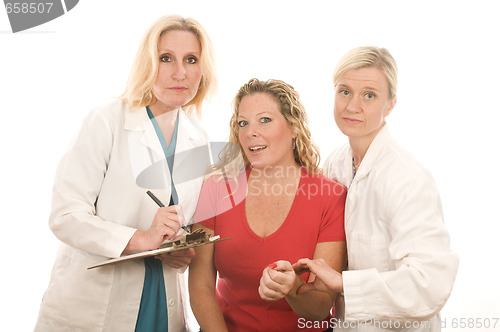 Image of two doctors nurses in medical scrubs clothes with patient