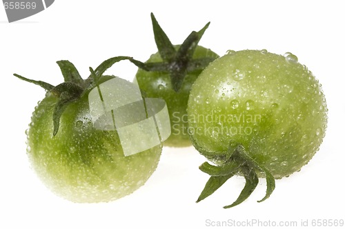 Image of green tomato on white