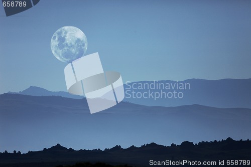 Image of Ghostly Mountain Silhouettes and Moon