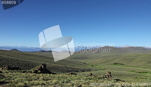 Image of Sierra Mountains With Green Field