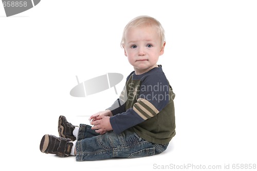 Image of Serene Baby Boy Sitting Sideways