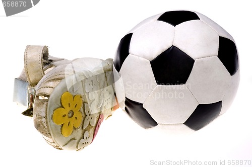 Image of Baby football shoes and ball on white background