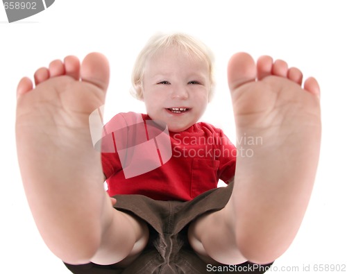 Image of Silly Baby Boy Lying on His Back Laughing