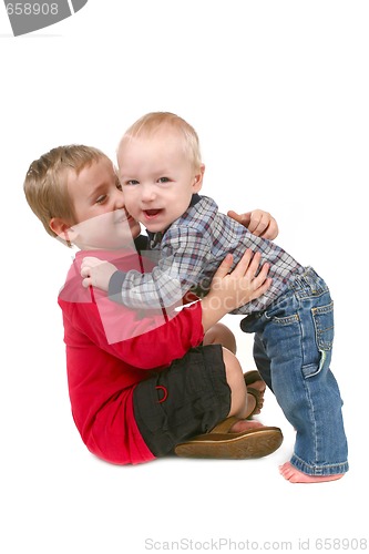 Image of 2 Brothers Hugging Eachother on White Background