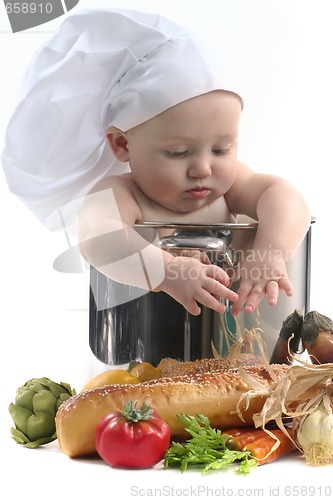 Image of Cute Chubby Baby Chef in a Cooking Pot Looking Downwards