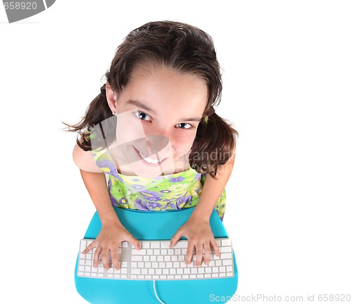 Image of Cute Little Girl Typing on a Computer Keyboard