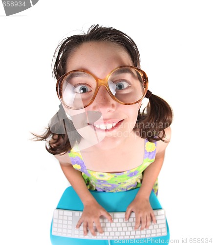 Image of Kid Using Computer Looking Up Smiling