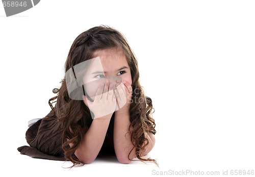 Image of Adorable Little Girl Covering Her Mouth Laughing