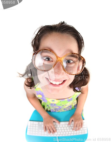 Image of Nerdy Kid Using Computer Looking Up Smiling
