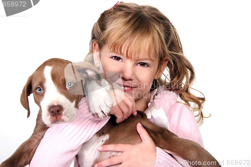 Image of Adorable Little Girl Holding Her Puppy