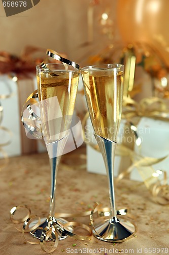 Image of Celebration of an Event With Champagne Glasses and Gifts