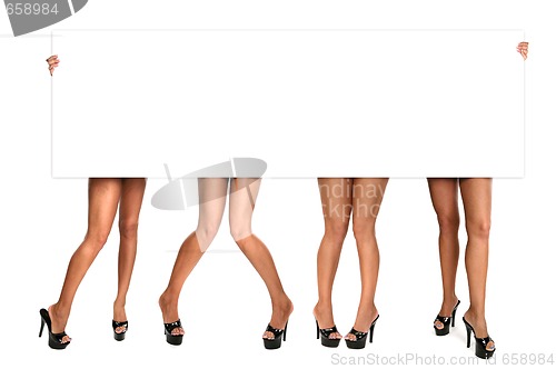 Image of Womens Legs Holding up a Blank Sign