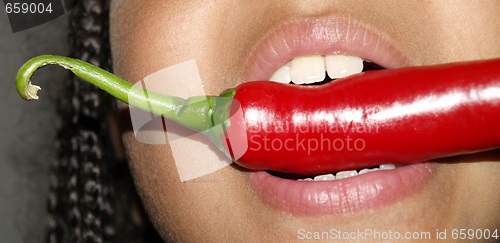 Image of girl tasting chilli