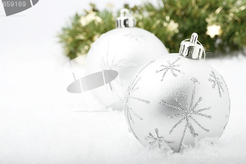 Image of Silver Christmas baubles.