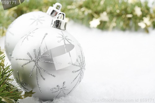 Image of Silver Christmas baubles.
