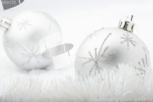 Image of Silver Christmas baubles.