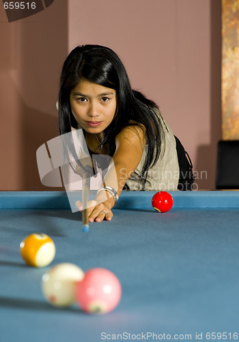 Image of woman playing pool