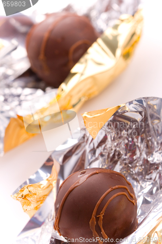 Image of two opened foil candies
