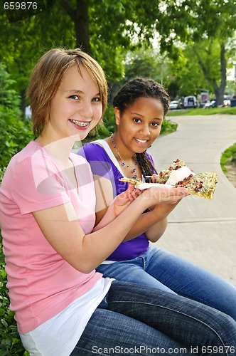 Image of Girls eating pizza