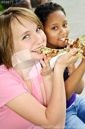 Image of Girls eating pizza
