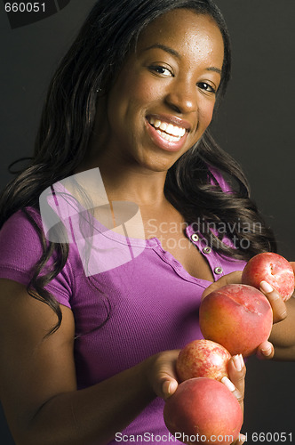 Image of pretty hispanic african american woman with healthy bowl of fres